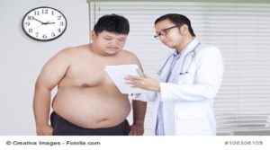 Portrait of male doctor showing the test result to the overweight patient, shoot in the hospital